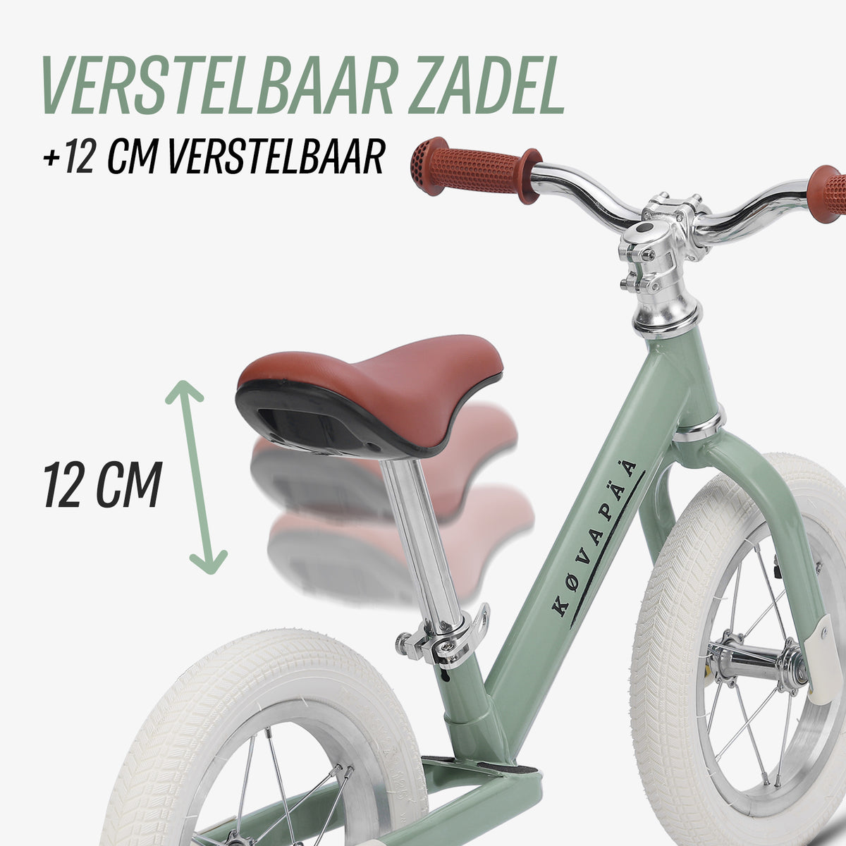 zadel van groene Køvapää loopfiets 10 cm in hoogte verstelbaar