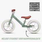 gratis stickerset bij groene Køvapää loopfiets