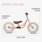afmetingen van roze Køvapää 2-in-1 loopfiets in beeld gebracht