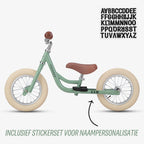 gratis stickerset bij groene Køvapää 2-in-1 loopfiets